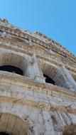 Beautiful, old building with arches, in Rome, Italy, under the blue sky