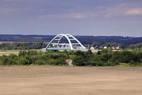 beautiful white bridge in the trees