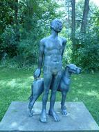 Bronze sculpture in park, Man with Dog