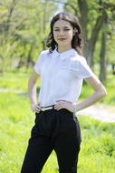 female student posing on blurred background