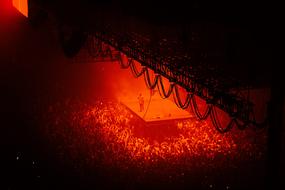 Crowd concert people red background