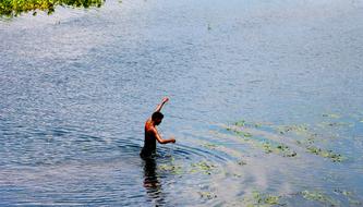 Fisherman Fishing in River