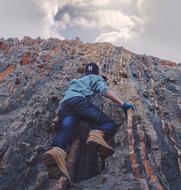 Guy rocks cliff adventure