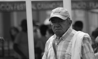 adult man on city street in black and white blurred background