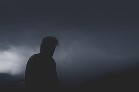Man Guy at storm clouds