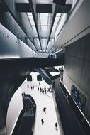 people climb the stairs in a modern building