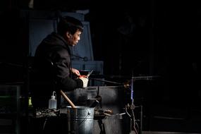 man with scissors in the workshop