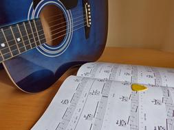 Guitar blue and music book