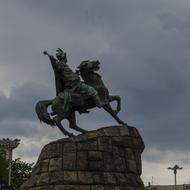 Beautiful sculpture of Bogdan on the horse, in Khmelnitsky, Ukraine, under the sky with dark clouds