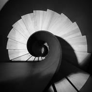 Black And White photo of spiral Stairs