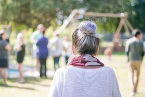 girl on a blurred background of people on a sunny day