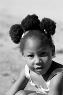 african american girl with hairstyle in black and white background