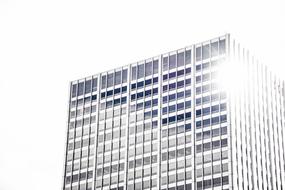 Building with windows, in light, at white background