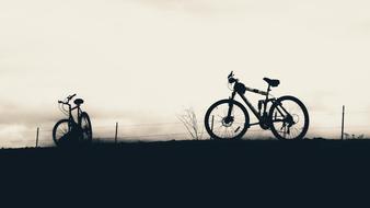 silhouette of a bicycle on the field