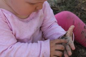 Child Hand Stones play