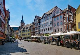 Street with the colorful and beautiful buildings in Wertheim, Germany, under the blue sky with clouds