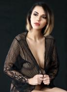 Portrait of the beautiful, blonde girl with the make-up and black clothing