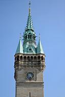 tall building with a green roof