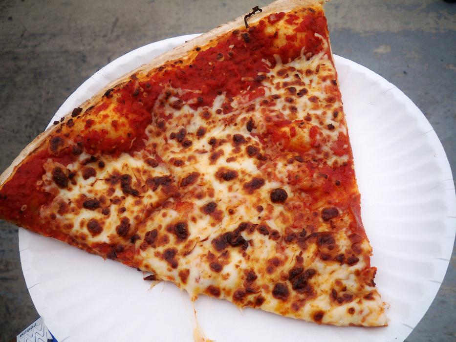 Cheesy slice of pizza