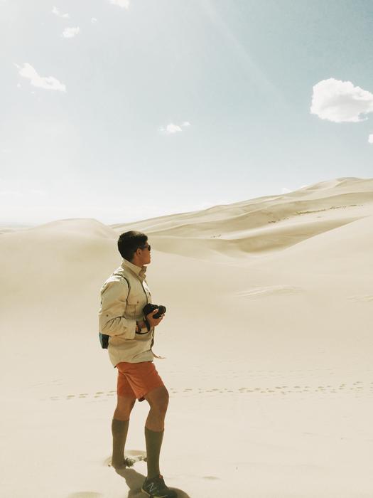 photo of a young man in the desert