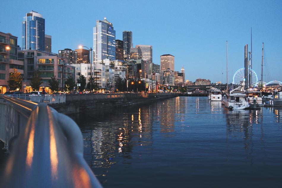 Port of the city, with boats and colorful lights, in the evening