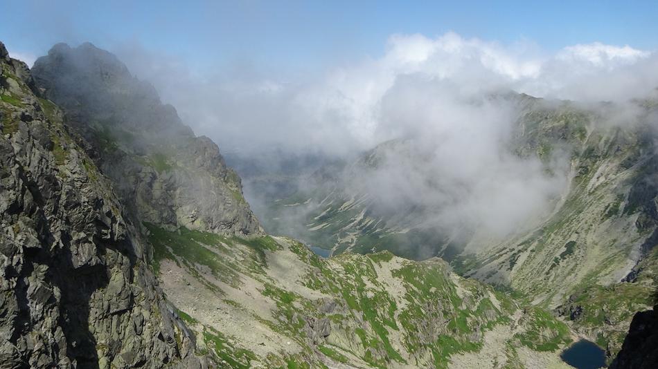 cloudy weather in the mountains in green grasses