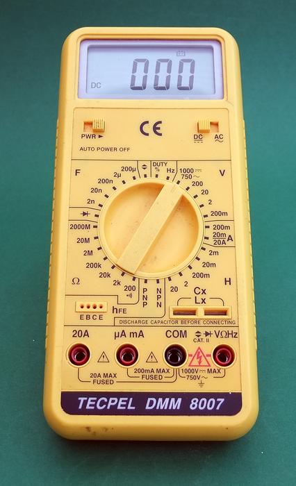 multimeter on a green table
