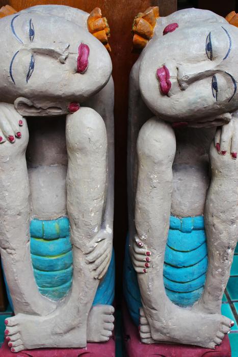 stone religious meditating sculptures