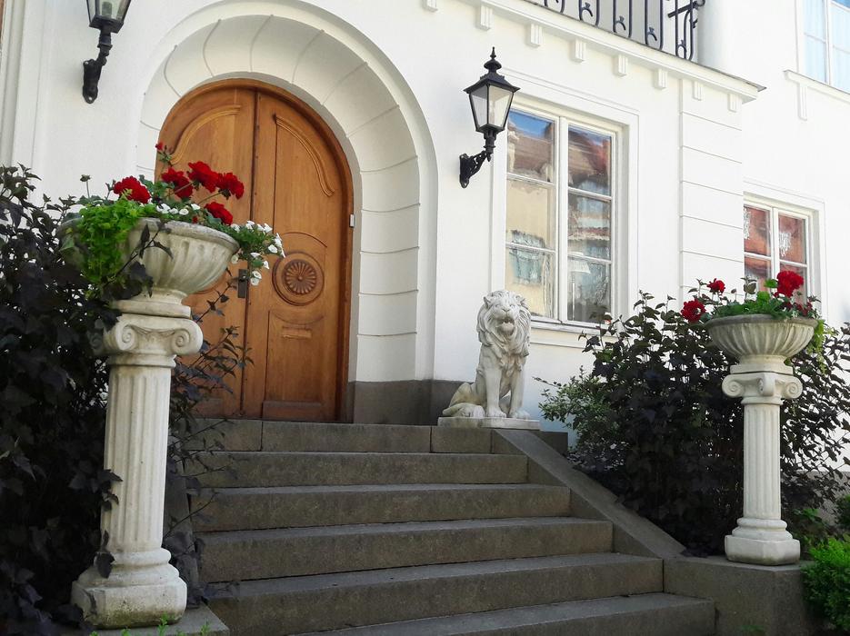 Beautiful facade of the building with pillars and plants, in Sweden