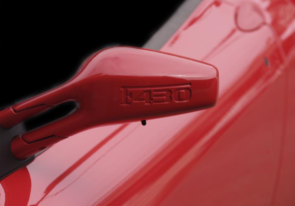 red car with a view of the side window