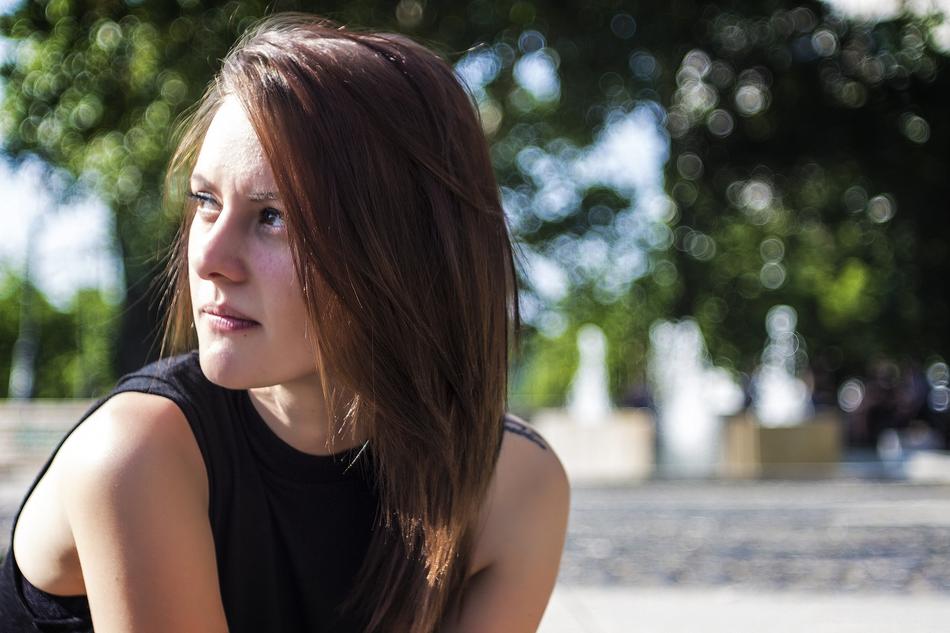 Portrait of a brunette looking sideways on sunny day