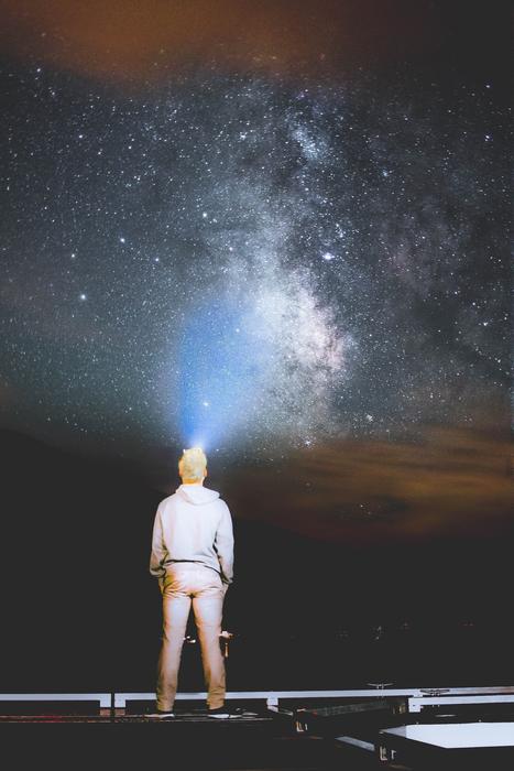 a man in the moonlight on a starry sky
