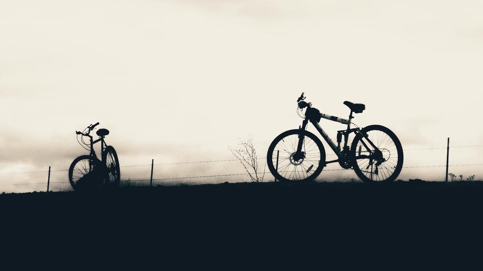 silhouette of a bicycle on the field