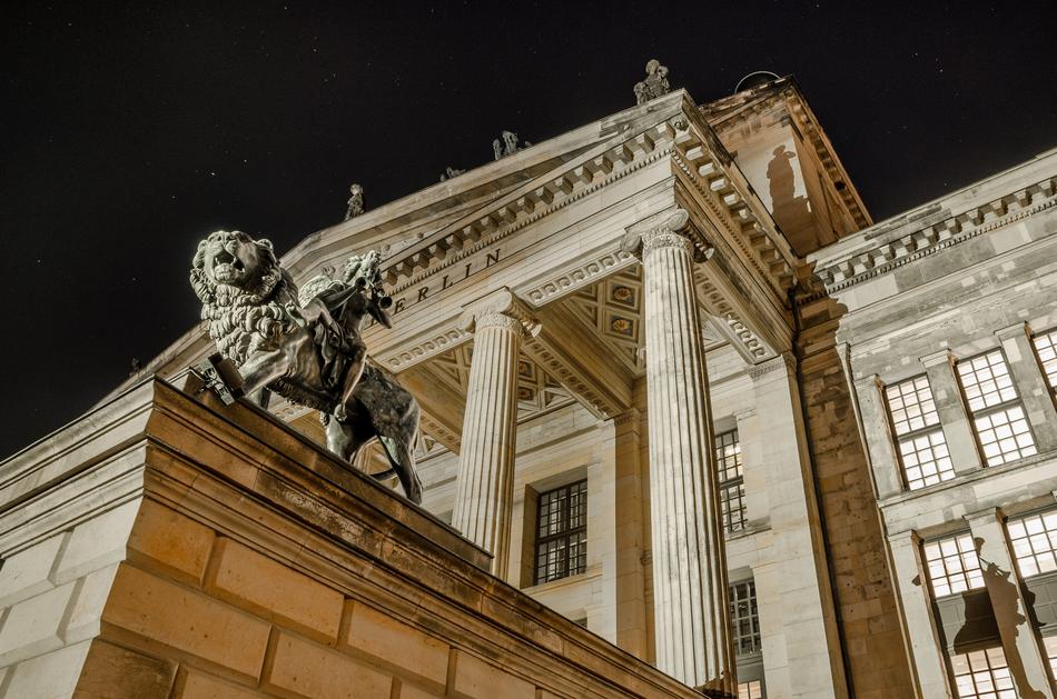 Building with columns and figures, in Berlin, Germany, at the night