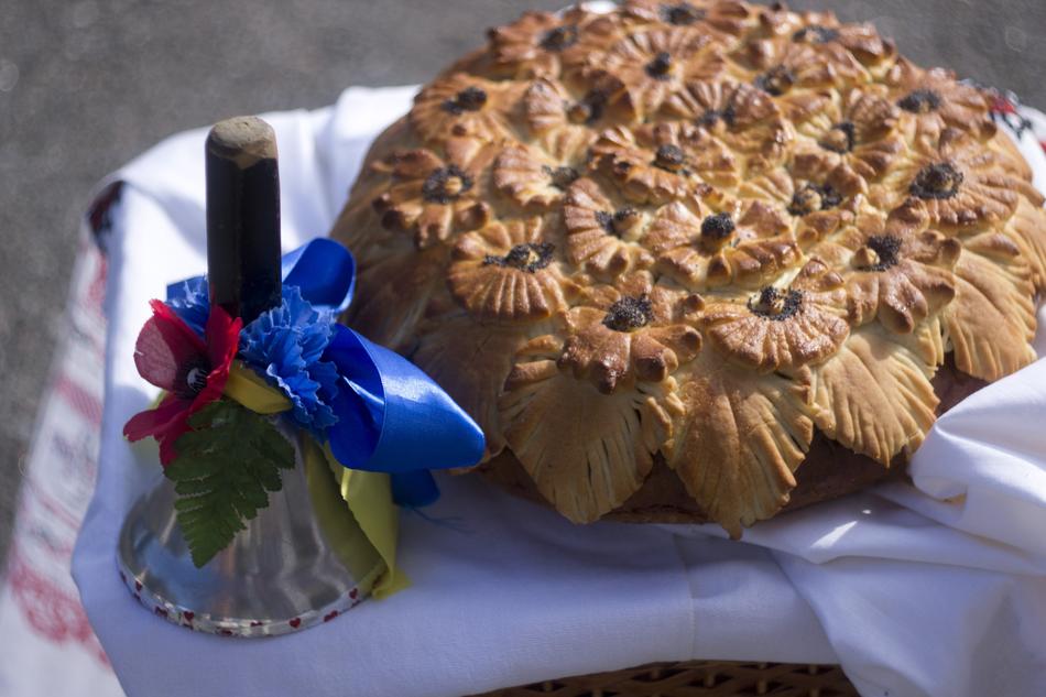 Beautiful cake and decorated bell on the day of Knowledge