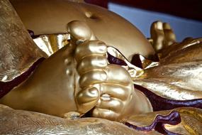 golden feet of the statue