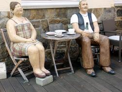 sculpture of pensioners in a cafe