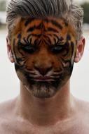 Man with Tiger painting on Face