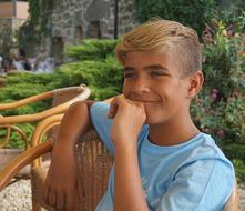 pensive guy on a garden chair