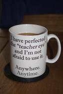 white mug with a signature