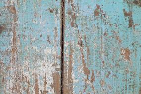 Close-up of the wooden texture with boards, with blue and white paint