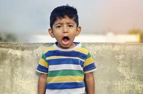 Child Shouting greq wall