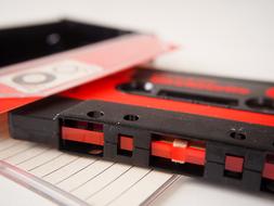 photo of black and red audio cassette