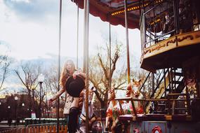 Girl, walking in the colorful Gorky Park, with the trees, in light, in Moscow, Russia