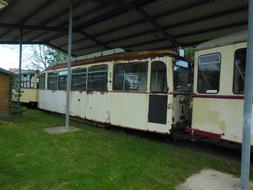 old rusty tram under a canopy
