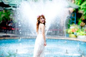 girl near Blue Water fountain in Garden