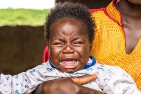 photo of crying african baby