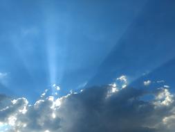 blue sky in the clouds in the sunlight