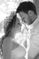 monochrome photo of newlyweds at the window