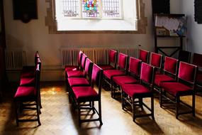 red velvet chairs in church school